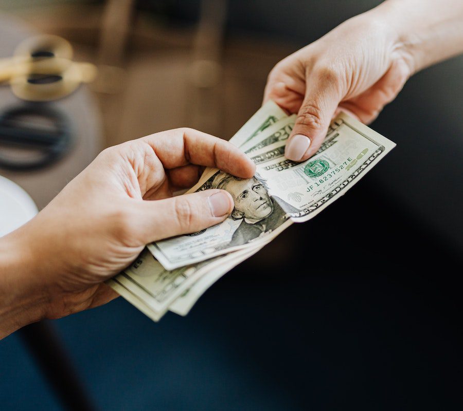 Hands Holding Us Dollar Bills Hands Holding Us Dollar Bills